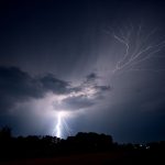 lightning strikes the ground and spreads into the sky as a lightning crawler nears jeanette