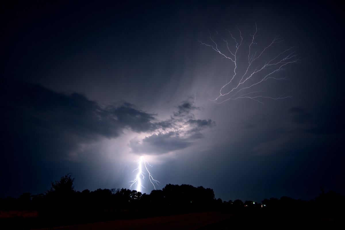 lightning strikes the ground and spreads into the sky as a lightning crawler nears jeanette 