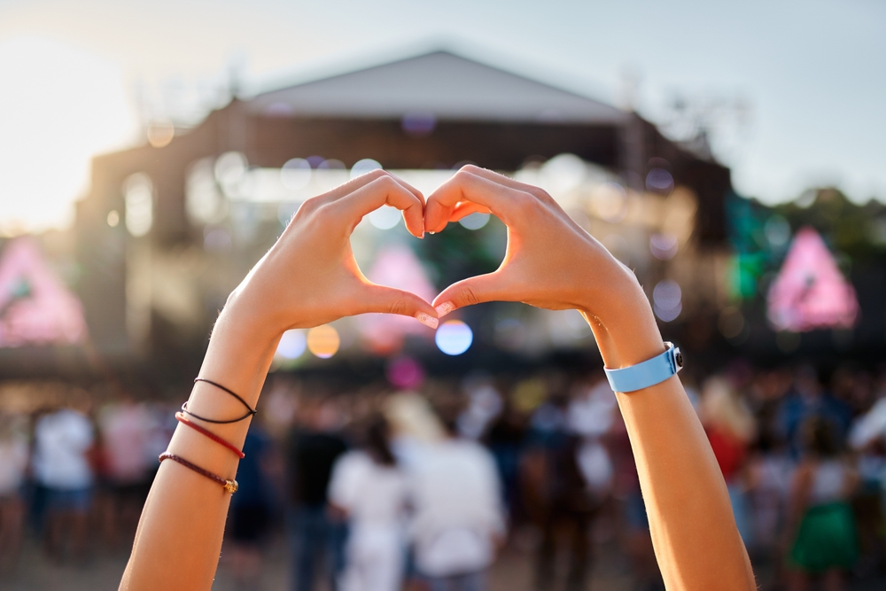 hands,shape,heart,sign,at,sunset,beach,music,fest,,crowd