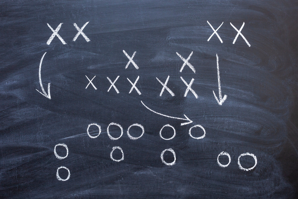 game,strategy,in,football,drawn,in,white,chalk,on,a